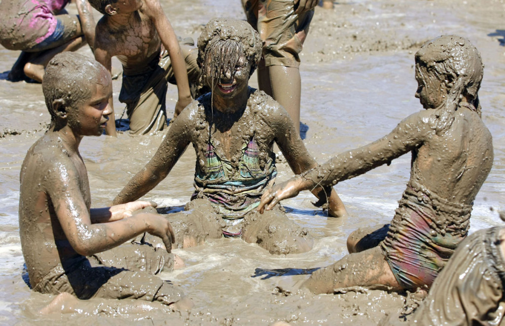 Kids Frolic In The Mud On Michigan Town's 25th Annual "Mud Day"